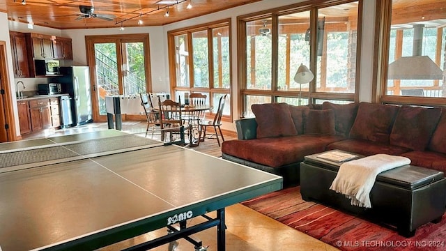 playroom with plenty of natural light, a sink, and ceiling fan