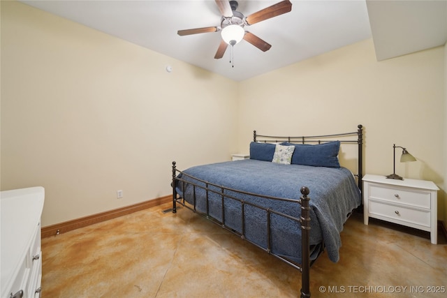 bedroom featuring ceiling fan, finished concrete flooring, and baseboards