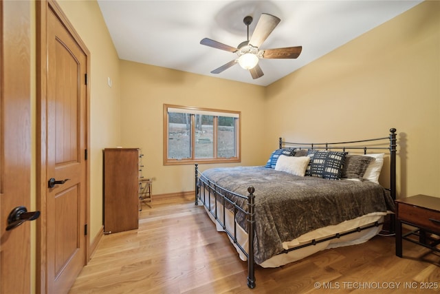 bedroom featuring a ceiling fan and light wood finished floors