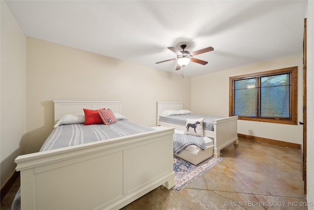 bedroom featuring a ceiling fan and baseboards