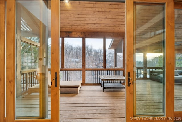 unfurnished sunroom featuring plenty of natural light