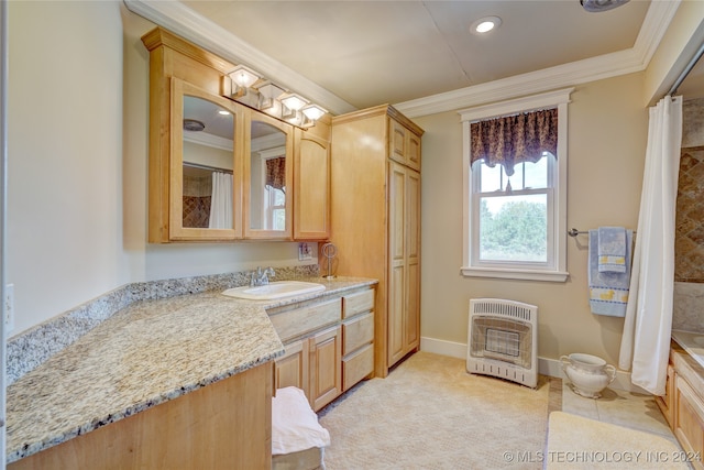 bathroom featuring tile patterned floors, crown molding, vanity, and heating unit