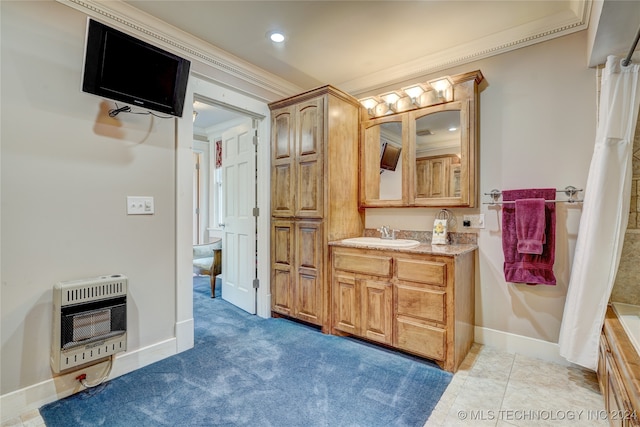 bathroom featuring tile patterned floors, crown molding, vanity, and heating unit