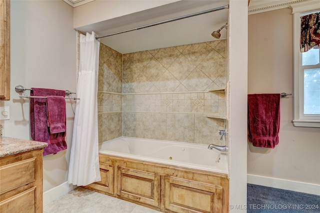 bathroom with vanity, shower / bathtub combination with curtain, and tile patterned floors