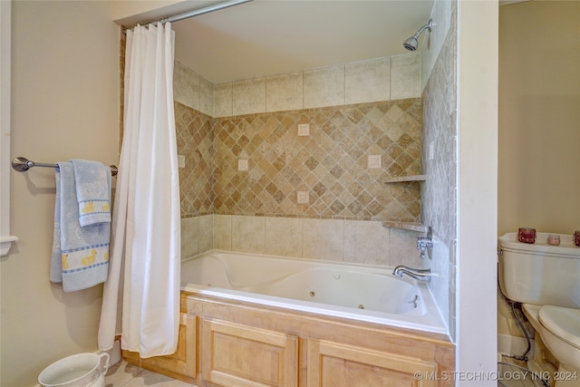 bathroom with shower / tub combo and toilet