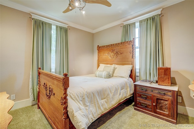 bedroom with light carpet, crown molding, multiple windows, and ceiling fan