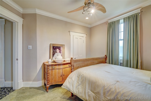 bedroom with crown molding, ceiling fan, and carpet