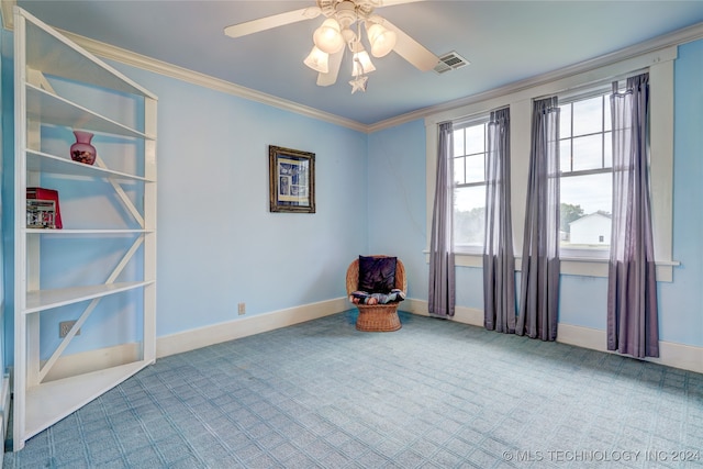 unfurnished room with crown molding, carpet, and ceiling fan