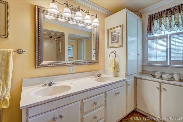 bathroom featuring crown molding and vanity