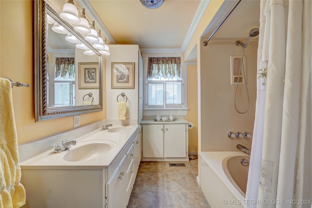 bathroom featuring crown molding, tile patterned flooring, shower / bath combo with shower curtain, and vanity