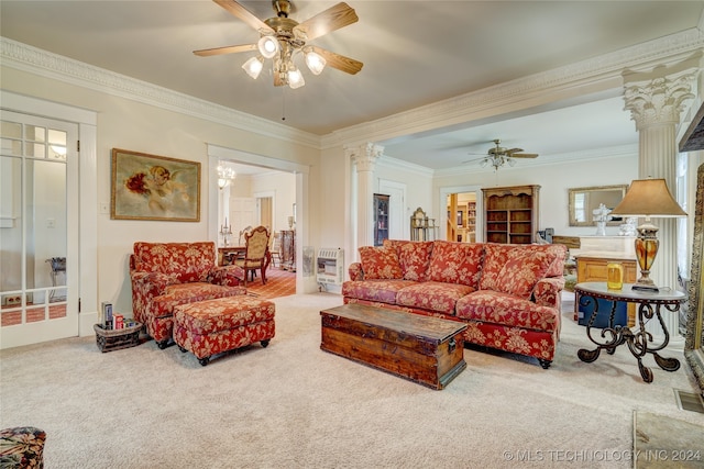 living room featuring ceiling fan, ornamental molding, heating unit, light colored carpet, and ornate columns