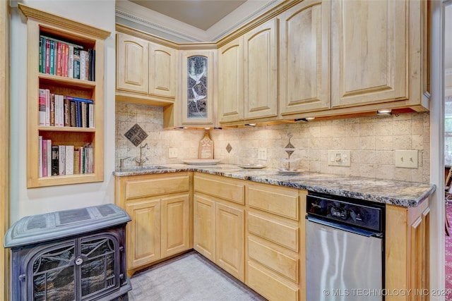 kitchen featuring light stone countertops, decorative backsplash, sink, and light brown cabinets