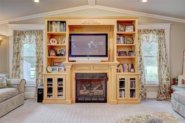 living room with crown molding, vaulted ceiling, and carpet