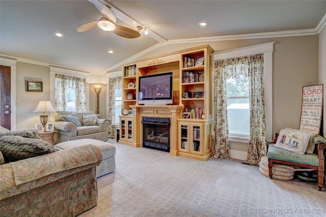 living room featuring crown molding, vaulted ceiling, light colored carpet, and a healthy amount of sunlight