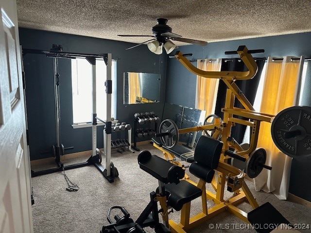 exercise area with ceiling fan, a textured ceiling, and carpet floors