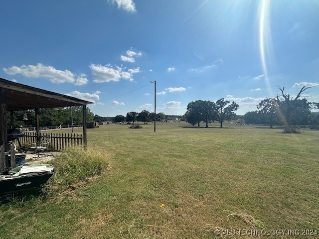 view of yard with a rural view