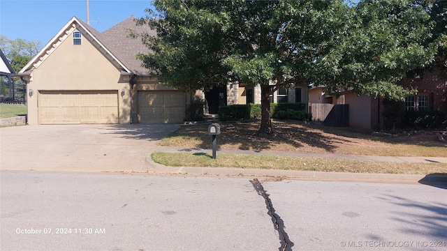 obstructed view of property featuring a garage