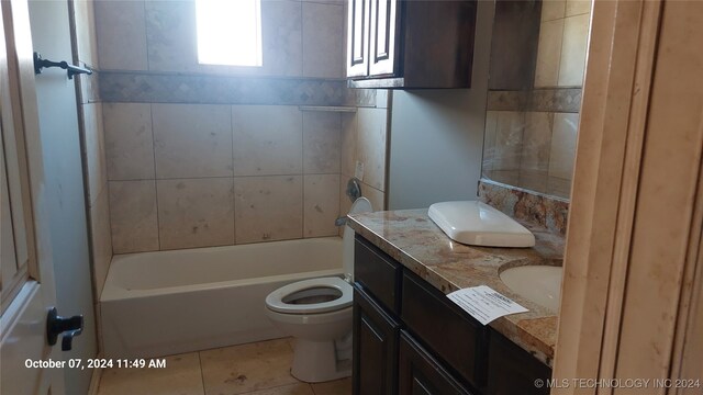 full bathroom with bathing tub / shower combination, toilet, tile patterned flooring, and vanity