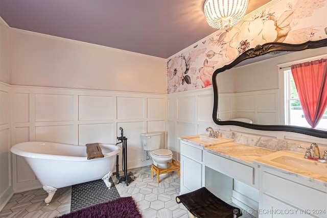 bathroom featuring a tub to relax in, vanity, and toilet