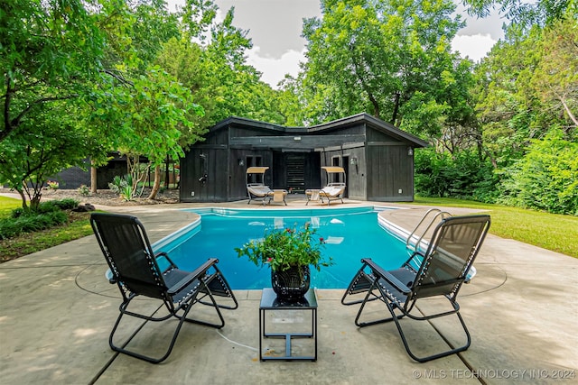 view of pool featuring a patio