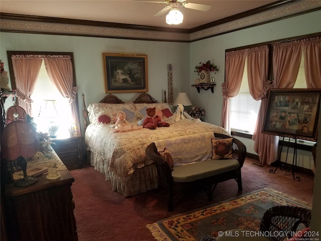 carpeted bedroom featuring ceiling fan and crown molding