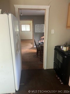 corridor featuring dark hardwood / wood-style floors