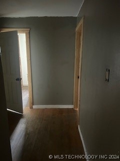 hall with hardwood / wood-style floors