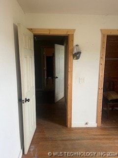 corridor with wood-type flooring