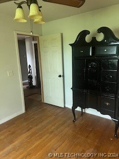 bedroom with hardwood / wood-style flooring