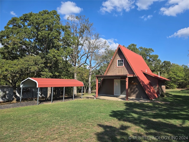 view of outbuilding with a carport and a lawn