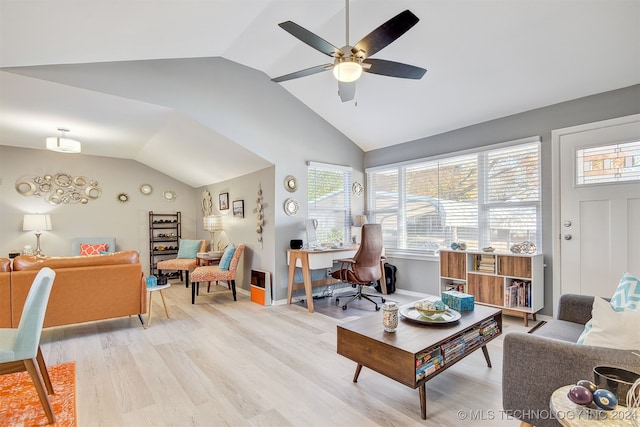 living room featuring ceiling fan, light hardwood / wood-style floors, and lofted ceiling