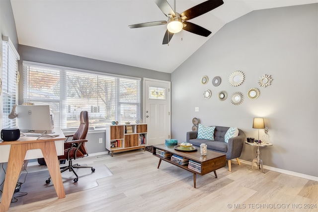 home office with ceiling fan, high vaulted ceiling, and light wood-type flooring