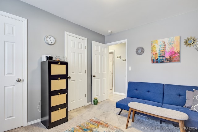 sitting room with light colored carpet