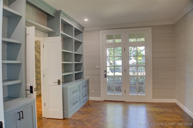 doorway featuring parquet flooring and ornamental molding