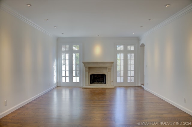 unfurnished living room featuring crown molding and dark hardwood / wood-style flooring