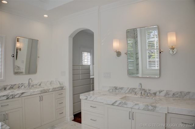 bathroom featuring vanity and ornamental molding