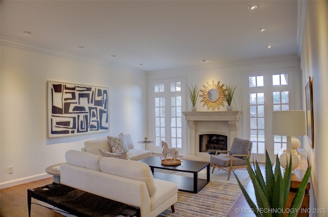 living room featuring crown molding and hardwood / wood-style floors