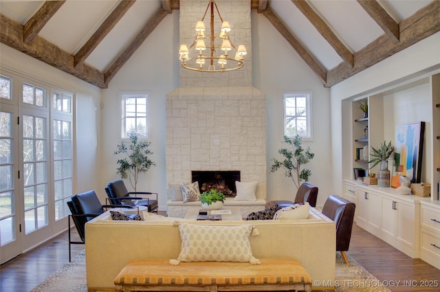 living room featuring an inviting chandelier, high vaulted ceiling, a fireplace, dark hardwood / wood-style flooring, and beam ceiling