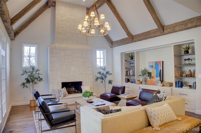 living room with beam ceiling, a stone fireplace, wood-type flooring, and high vaulted ceiling