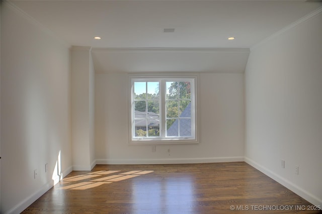 empty room featuring crown molding and hardwood / wood-style floors