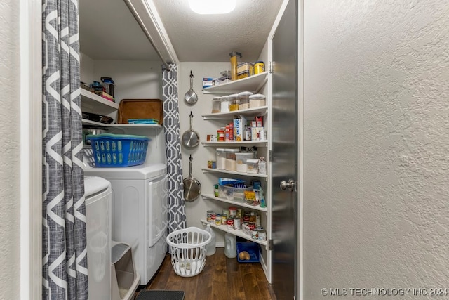 pantry with washer and clothes dryer