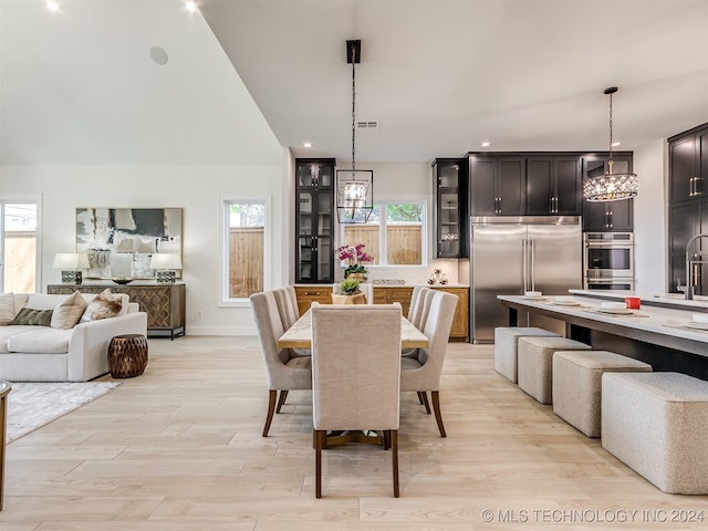 dining room featuring light hardwood / wood-style flooring and sink