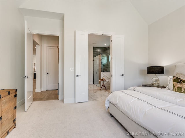 carpeted bedroom with vaulted ceiling