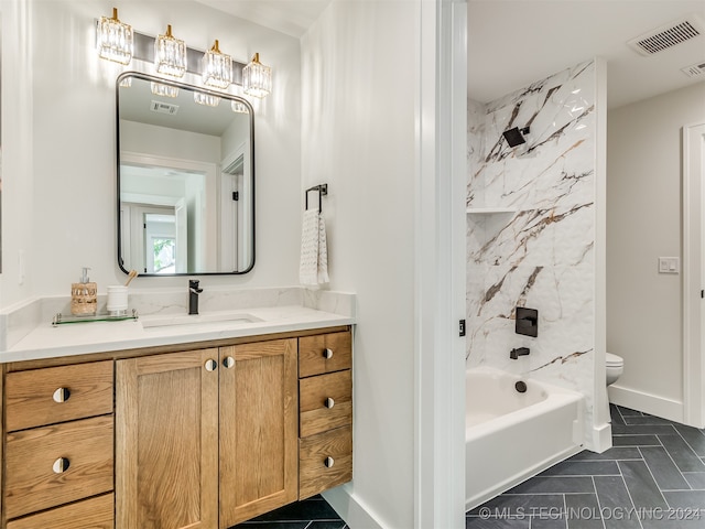 full bathroom featuring shower / bathing tub combination, vanity, and toilet