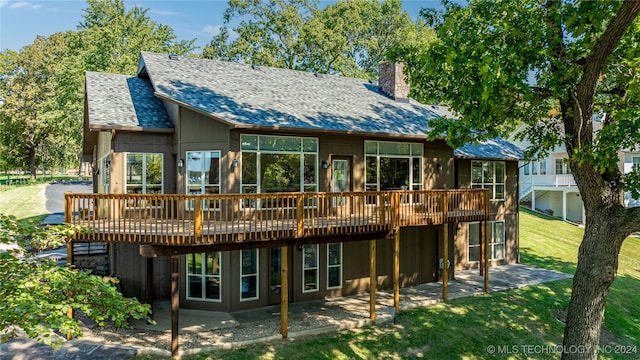 back of house with a patio area, a deck, and a yard