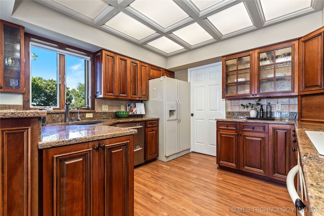 kitchen with light hardwood / wood-style flooring, decorative backsplash, coffered ceiling, and white refrigerator with ice dispenser