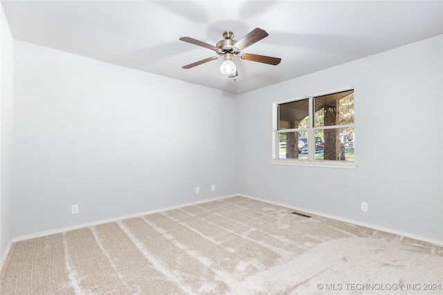 unfurnished room with carpet floors and ceiling fan