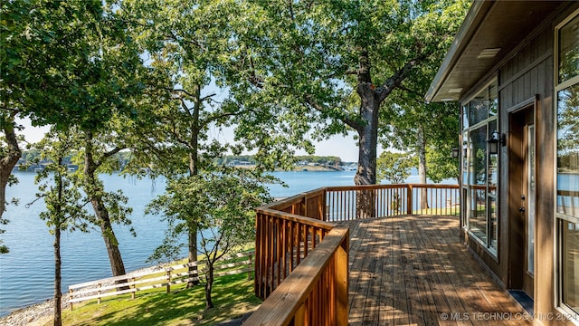 wooden terrace with a water view