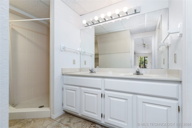 bathroom with vanity, walk in shower, and tile patterned floors