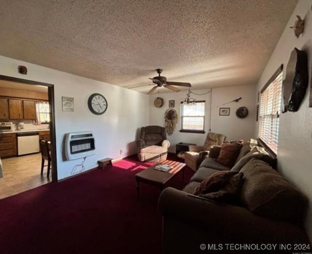 living room featuring a textured ceiling, heating unit, and ceiling fan